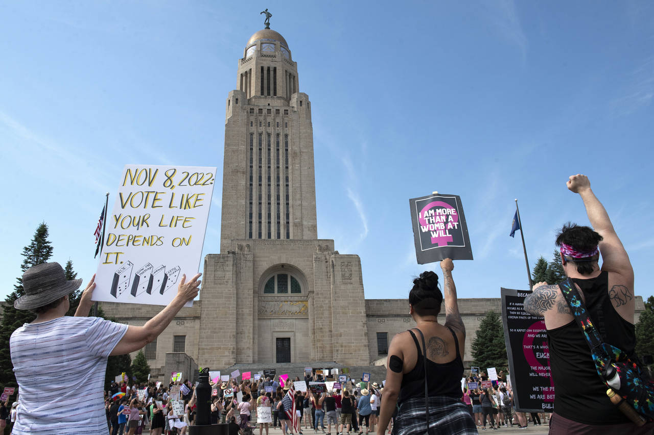 FILE - Protesters line the street around the front of the Nebraska State Capitol during an Abortion...