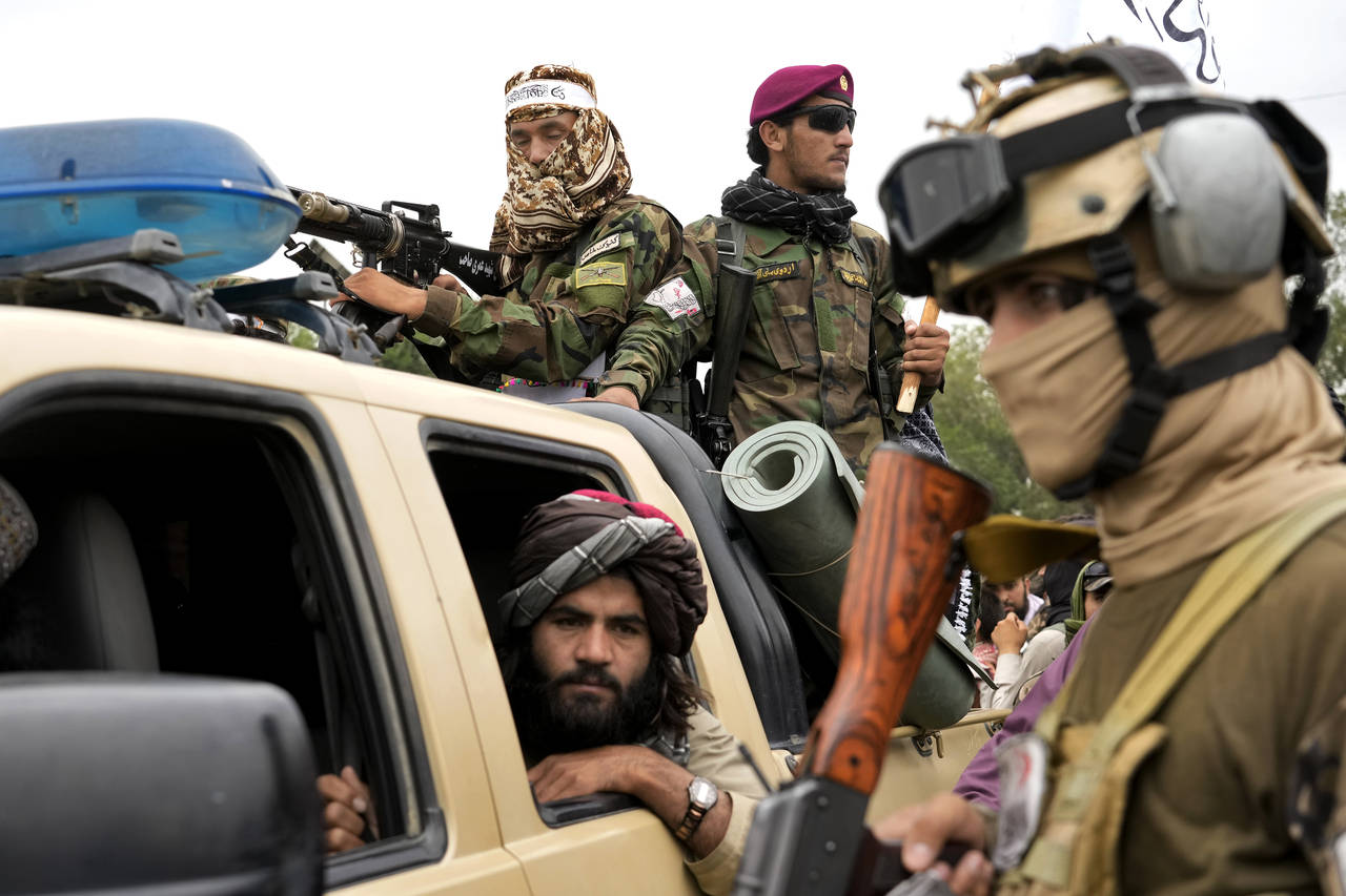 Taliban fighters celebrate one year since they seized the Afghan capital, Kabul, in front of the U....