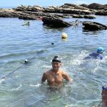 
              Lu Chuan-hsiong, center, swims along the coast near Keelung in Taiwan, Thursday, Aug. 4, 2022. Lu, 63, who was enjoying his morning swim, says he wasn't worried about the recent China and Taiwan tensions. "Because Taiwanese and Chinese, we're all one family. There's a lot of mainlanders here, too," he said. (AP Photo/Johnson Lai)
            
