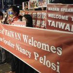 Supporters hold a banner outside the hotel where U.S. House Speaker Nancy Pelosi is supposed to be staying in Taipei, Taiwan, Tuesday, Aug 2, 2022. U.S. House Speaker Nancy Pelosi was believed headed for Taiwan on Tuesday on a visit that could significantly escalate tensions with Beijing, which claims the self-ruled island as its own territory. (AP Photo/Chiang Ying-ying)