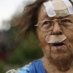 
              Valentyna Kondratieva, 75, stands outside her damaged home Saturday, Aug. 13, 2022, where she sustained injuries in a Russian rocket attack last night in Kramatorsk, Donetsk region, eastern Ukraine. The strike killed three people and wounded 13 others, according to the mayor. The attack came less than a day after 11 other rockets were fired at the city. (AP Photo/David Goldman)
            
