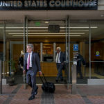 
              Robert Walters, center, an attorney representing three LIV Golf players, leaves a federal courthouse in San Jose, Calif., Tuesday, Aug. 9, 2022. A federal judge has ruled that three golfers who joined Saudi-backed LIV Golf will not be able to compete in the PGA Tour's postseason. (AP Photo/Godofredo A. Vásquez)
            