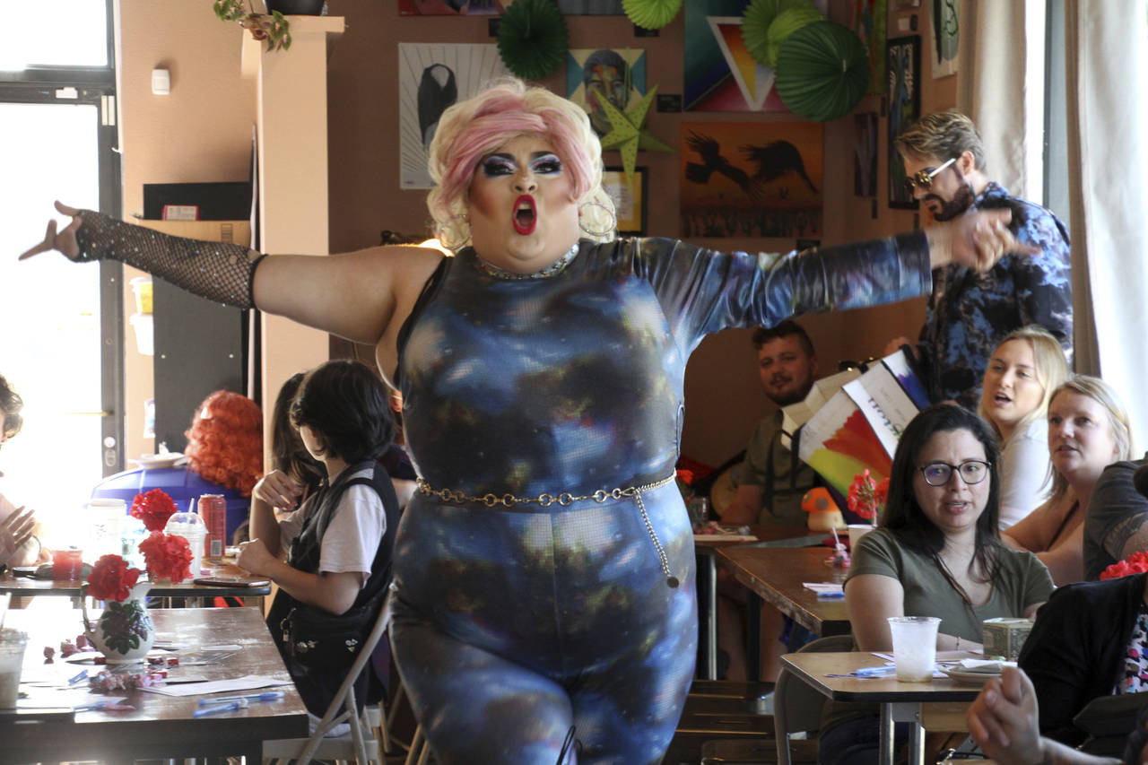 This July 28, 2022, photo shows drag queen Dela Rose performing in a mock election at Cafecito Boni...