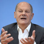 
              German Chancellor Olaf Scholz addresses the media during his first annual summer news conference in Berlin, Germany, Thursday, Aug. 11, 2022. (AP Photo/Michael Sohn)
            