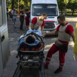 
              Volunteers of the Ukrainian Red Cross emergency transport a wounded man from one to another hospital in Mykolaiv, Ukraine, Tuesday, Aug. 9, 2022. (AP Photo/Evgeniy Maloletka)
            