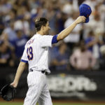 
              New York Mets pitcher Jacob deGrom tips his cap to Brandon Nimmo during the seventh inning of the team's baseball game against the Los Angeles Dodgers on Wednesday, Aug. 31, 2022, in New York. The Mets won 2-1. (AP Photo/Adam Hunger)
            