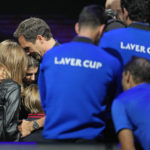
              An emotional Roger Federer of Team Europe embraces his wife Mirka and their children after playing with Rafael Nadal in a Laver Cup doubles match against Team World's Jack Sock and Frances Tiafoe at the O2 arena in London, Friday, Sept. 23, 2022. Federer's losing doubles match with Nadal marked the end of an illustrious career that included 20 Grand Slam titles and a role as a statesman for tennis. (AP Photo/Kin Cheung)
            