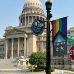 
              A Boise Pride Festival banner hangs on a lamp post in front of the Idaho Statehouse on Friday, Sept. 9, 2022 in Boise, Idaho. Organizers of the three-day festival starting Friday evening have been subjected to intense political pushback from the Idaho GOP and conservative groups in part because of a "Drag Kids" performance scheduled for Sunday. (AP Photo/Rebecca Boone)
            