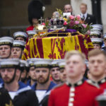 
              The coffin of Queen Elizabeth II is placed on a gun carriage during her funeral service in Westminster Abbey in central London Monday Sept. 19, 2022.The Queen, who died aged 96 on Sept. 8, will be buried at Windsor alongside her late husband, Prince Philip, who died last year. (AP Photo/Emilio Morenatti,Pool)
            