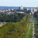 
              People make their way along the Long Walk towards Cambridge gate outside Windsor Castle to lay flowers for the late Queen Elizabeth II in Windsor, England, Sunday, Sept. 18, 2022. The Queen will lie in state in Westminster Hall for four full days before her funeral on Monday Sept. 19. (AP Photo/Gregorio Borgia)
            