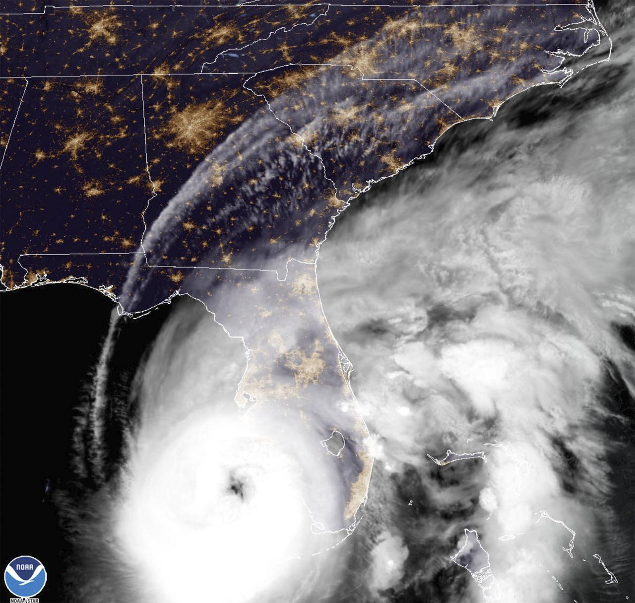 This satellite image provided by NOAA shows Hurricane Ian off Florida's southwest coast Wednesday, ...