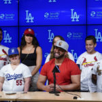 
              St. Louis Cardinals designated hitter Albert Pujols, center, is surrounded by his family while speaking to reporters after a baseball game against the Los Angeles Dodgers in Los Angeles, Friday, Sept. 23, 2022. Pujols hit his 700th home run during the fourth inning. (AP Photo/Ashley Landis)
            