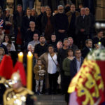 
              Members of the public pay their respects to Queen Elizabeth II during the lying in State inside Westminster Hall, at the Palace of Westminster in London, Sunday, Sept. 18, 2022.  (Jeff J Mitchell/Pool Photos via AP)
            