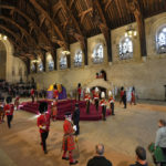 
              The King's Body Guard, formed of Gentlemen at Arms, Yeomen of the Guard and Scots Guards, change guard duties around the coffin of Queen Elizabeth II, Lying in State inside Westminster Hall, at the Palace of Westminster, in London, Sunday, Sept. 18, 2022, ahead of her funeral on Monday. (AP Photo/Vadim Ghirda, pool)
            