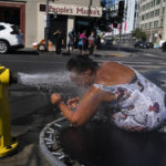 
              Stephanie Williams, 60, cools off with water from a hydrant in the Skid Row area of Los Angeles, Wednesday, Aug. 31, 2022. Excessive-heat warnings expanded to all of Southern California and northward into the Central Valley on Wednesday, and were predicted to spread into Northern California later in the week. (AP Photo/Jae C. Hong)
            