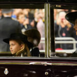 
              Britain's Princess Charlotte, left, Prince George, background, and Camilla, the Queen Consort, right, arrive by car ahead of the Queen Elizabeth II funeral in central London, Monday, Sept. 19, 2022. The Queen, who died aged 96 on Sept. 8, will be buried at Windsor alongside her late husband, Prince Philip, who died last year. (AP Photo/Andreea Alexandru, Pool)
            