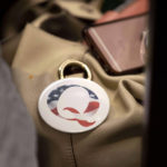 
              FILE - A QAnon conspiracy theory button sits affixed to the purse of an attendee of the Nebraska Election Integrity Forum on Saturday, Aug. 27, 2022, in Omaha, Neb. Former President Donald Trump is increasingly embracing and endorsing the QAnon conspiracy theory, even as the number of frightening real-world incidents linked to the movement increase. On Tuesday, Sept. 13, 2022, using his Truth Social platform, Trump reposted an image of himself — wearing a Q lapel pin — overlaid with the words “The Storm is Coming." (AP Photo/Rebecca S. Gratz, File)
            