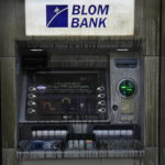 
              An ATM is covered with diesel fuel after it was vandalized by angry depositors who attacked a bank, in Beirut, Lebanon, Wednesday, Sept. 14, 2022. An armed woman and a dozen activists broke into a Beirut bank branch on Wednesday, taking over $13,000 from what she says were from her trapped savings. Lebanon's cash-strapped banks since 2019 have imposed strict limits on withdrawals of foreign currency, tying up the savings of millions of people. (AP Photo/Hussein Malla)
            