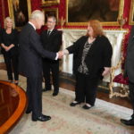 
              Britain's King Charles III meets Alliance Party Leader Naomi Long as Sinn Fein Vice President Michelle O'Neill, second left, DUP leader Jeffrey Donaldson, third right, and UUP leader Doug Beattie, right, look on at Hillsborough Castle, Belfast, Tuesday Sept. 13, 2022. King Charles III and Camilla, the Queen Consort, flew to Belfast from Edinburgh on Tuesday, the same day the queen’s coffin will be flown to London from Scotland. (Niall Carson/Pool via AP)
            