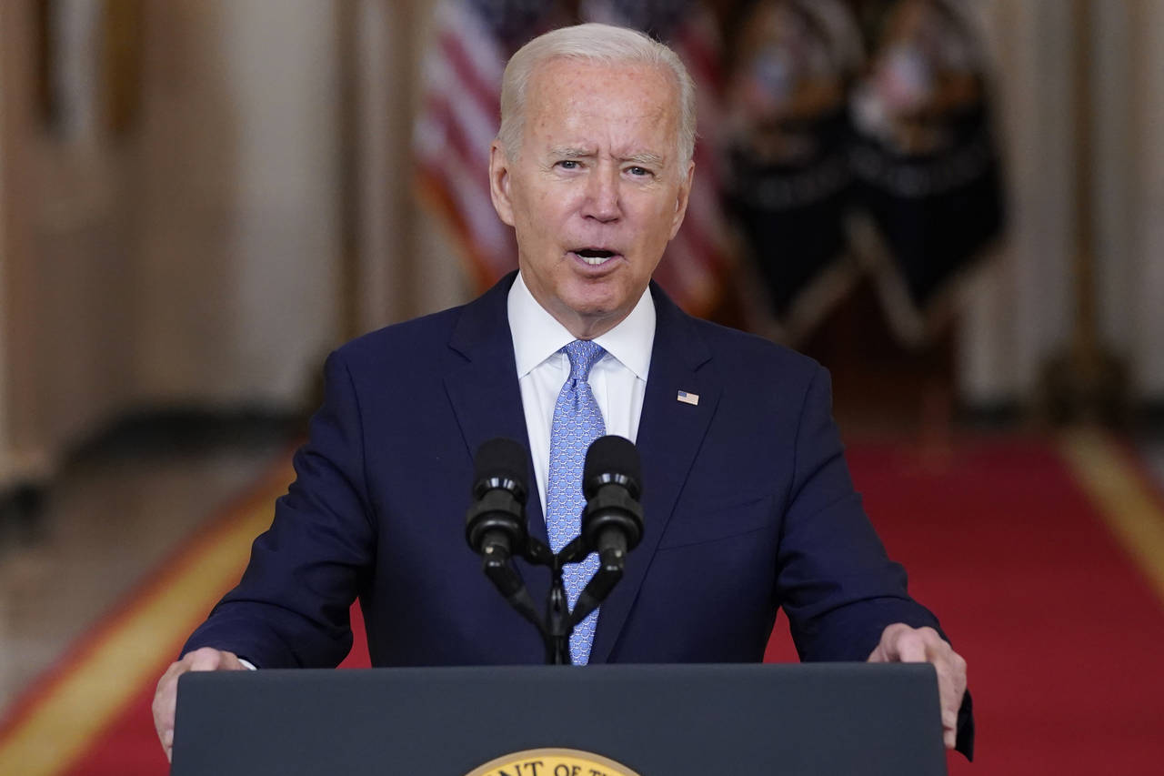 FILE - President Joe Biden speaks about the end of the war in Afghanistan from the State Dining Roo...