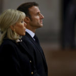 
              France's President Emmanuel Macron and first lady Brigitte Macron pay their respects to the coffin of Britain's Queen Elizabeth, following her death, during her lying-in-state at Westminster Hall, in London, Sunday Sept. 18, 2022. (John Sibley/Pool via AP)
            