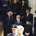 
              Camilla, the Queen Consort, Prince George, Princess Charlotte, Kate, Princess of Wales, Meghan, Duchess of Sussex and Sophie, Countess of Wessex stand after a service at Westminster Abbey on the day of the state funeral and burial of Britain's Queen Elizabeth in London, Monday Sept. 19, 2022. (Hannah Mckay/Pool Photo via AP)
            