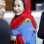 
              FILE - Rosmah Mansor, wife of Malaysian Prime Minister Najib Razak, arrives at Anti-Corruption Agency for questioning in Putrajaya, Malaysia, on June 5, 2018. Former first lady Rosmah was convicted Thursday, Sept. 1, 2022, of soliciting and receiving bribes during her husband’s corruption-tainted administration Thursday, a week after her husband was imprisoned over the massive looting of the 1MDB state fund (AP Photo/Vincent Thian, File)
            
