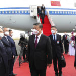 
              In this photo released by Xinhua News Agency, Chinese President Xi Jinping, center, is met by Kazakhstan's President Kassym-Jomart Tokayev, right, as he arrives at the Nur-sultan Nazarbayev International Airport for a state visit, Wednesday, Sept. 14, 2022, in Nur-Sultan, Kazakhstan. Chinese President Xi Jinping on Wednesday started his first foreign trip since the outbreak of the COVID-19 pandemic with a stop in Kazakhstan ahead of a summit with Russia's Vladimir Putin and other leaders of a Central Asian security group. (Yao Dawei/Xinhua via AP)
            