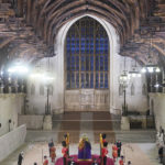 
              Black Rod pays her respects at 06:30am inside Westminster Hall on the final day of the lying in state at the coffin of Queen Elizabeth II, draped in the Royal Standard with the Imperial State Crown and the Sovereign's orb and sceptre, lying in state on the catafalque in Westminster Hall, at the Palace of Westminster in London Monday, Sept. 19, 2022. (Yui Mok/Pool Photo via AP)
            