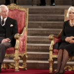 
              Britain's King Charles III, left, and Camilla, the Queen Consort, sit at Westminster Hall, where both Houses of Parliament are meeting to express their condolences following the death of Queen Elizabeth II, at Westminster Hall, in London, Monday, Sept. 12, 2022. Queen Elizabeth II, Britain's longest-reigning monarch, died Thursday after 70 years on the throne. (Henry Nicholls/Pool Photo via AP)
            