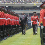 
              Kenya's outgoing President Uhuru Kenyatta inspects the guard of honour at a swearing-in ceremony for new president William Ruto, at Kasarani stadium in Nairobi, Kenya Tuesday, Sept. 13, 2022. William Ruto was sworn in as Kenya's president on Tuesday after narrowly winning the Aug. 9 election and after the Supreme Court last week rejected a challenge to the official results by losing candidate Raila Odinga. (AP Photo/Brian Inganga)
            