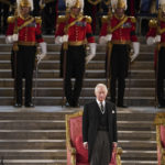 
              King Charles III stands in Westminster Hall, London, where both Houses of Parliament met to express their condolences following the death of Queen Elizabeth II, at Westminster Hall, in London, Monday, Sept. 12, 2022. Queen Elizabeth II, Britain's longest-reigning monarch and a rock of stability across much of a turbulent century, died Thursday Sept. 8, 2022, after 70 years on the throne. She was 96. (Joe Giddens /Pool Photo via AP)
            