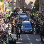 
              King Charles III,  Princess Anne and members of the Royal family join the procession of Queen Elizabeth II's coffin from the Palace of Holyroodhouse to St Giles' Cathedral, in Edinburgh, Monday, Sept. 12, 2022. King Charles arrived in Edinburgh on Monday to accompany his late mother’s coffin on an emotion-charged procession through the historic heart of the Scottish capital to the cathedral where it will lie for 24 hours to allow the public to pay their last respects. (Andrew Milligan/Pool Photo via AP)
            