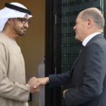 
              In this photo made available by the United Arab Emirates Presidential Court, Sheikh Mohamed bin Zayed Al Nahyan, President of the UAE left, shakes hands with German Chancellor Olaf Scholz, at Al Shati Palace in Abu Dhabi, United Arab Emirates, Sunday, Sept. 25, 2022. (Mohamed Al Hammadi/UAE Presidential Court via AP)
            