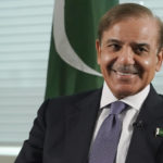
              Prime Minister of Pakistan Shehbaz Sharif smiles during an interview with The Associated Press, Thursday, Sept. 22, 2022, at United Nations headquarters. Sharif said he came to the United Nations to tell the world that his country is the victim of unprecedented climate change-induced flooding that has submerged one-third of its territory and left 33 million people scrambling to survive, and to warn that “tomorrow this tragedy can fall on some other country.” (AP Photo/Mary Altaffer)
            