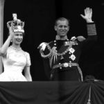 
              FILE - In this June. 2, 1953 file photo, Britain's Queen Elizabeth II and Prince Philip, Duke of Edinburgh wave to supporters from the balcony at Buckingham Palace, following her coronation at Westminster Abbey, London. Queen Elizabeth II, Britain’s longest-reigning monarch and a rock of stability across much of a turbulent century, has died. She was 96. Buckingham Palace made the announcement in a statement on Thursday Sept. 8, 2022. (AP Photo/Leslie Priest, File)
            