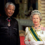
              FILE - In this Tuesday, July 9, 1996 file photo, South African President Nelson Mandela stands with Britain Queen Elizabeth II on his arrival at Buckingham Palace, in London for a state banquet in his honour following his arrival in Britain. Queen Elizabeth II, Britain’s longest-reigning monarch and a rock of stability across much of a turbulent century, has died. She was 96. Buckingham Palace made the announcement in a statement on Thursday Sept. 8, 2022. (Pool Photo via AP)
            