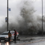 
              Waves crash over the breakwater in Busan, South Korea, Tuesday, Sept. 6, 2022. Thousands of people were forced to evacuate in South Korea as Typhoon Hinnamnor made landfall in the country's southern regions on Tuesday, unleashing fierce rains and winds that destroyed trees and roads, and left more than 20,000 homes without power. (Sohn Hyung-joo/Yonhap via AP)
            