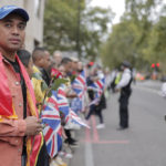 
              People wait to watch the State Funeral Service of Britain's Queen Elizabeth II, Monday, Sept. 19, 2022 in London. The Queen, who died aged 96 on Sept. 8, will be buried at Windsor alongside her late husband, Prince Philip, who died last year. (AP Photo/Lewis Joly)
            