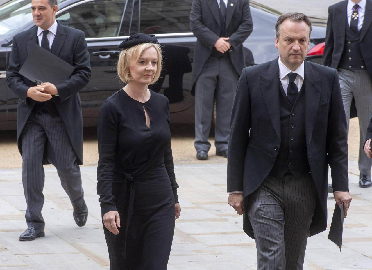 British Prime Minister Liz Truss and her husband Hugh O'Leary arrive for the funeral service of Que...