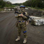 
              A Ukrainian serviceman stands at the checkpoint near the recently retaken area of Izium, Ukraine, Thursday, Sept. 15, 2022. (AP Photo/Evgeniy Maloletka)
            