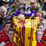 
              King Charles III and members of the Royal family follow behind the coffin of Queen Elizabeth II, draped in the Royal Standard with the Imperial State Crown and the Sovereign's orb and sceptre, as it is carried out of Westminster Abbey after her State Funeral, in London, Monday Sept. 19, 2022. The Queen, who died aged 96 on Sept. 8, will be buried at Windsor alongside her late husband, Prince Philip, who died last year. (Danny Lawson/Pool Photo via AP)
            