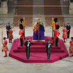 
              Black Rod walks through Westminster Hall at 06:29am to pay respect on the final day of the lying in state at the coffin of Queen Elizabeth II, draped in the Royal Standard with the Imperial State Crown and the Sovereign's orb and sceptre, lying in state on the catafalque in Westminster Hall, at the Palace of Westminster in London Monday, Sept. 19, 2022. (Yui Mok/Pool Photo via AP)
            