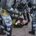 
              FILE - Police officers detain a person during an unsanctioned rally in Moscow on Saturday, July 27, 2019. Domestically, Russian President Vladimir Putin has moved dramatically away from Gorbachev's openness and freedom. He's been rebuilding the police state Gorbachev dismantled -- jailing his critics, branding them as traitors and extremists, including for merely calling the military operation in Ukraine a war. (AP Photo/Alexander Zemlianichenko, File)
            