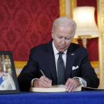 
              President Joe Biden signs a book of condolence at Lancaster House in London, following the death of Queen Elizabeth II, Sunday, Sept. 18, 2022. (AP Photo/Susan Walsh)
            