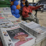 
              Kenyan newspapers show coverage of the death of Queen Elizabeth II, at a stand in downtown Nairobi, Kenya Friday, Sept. 9, 2022. Queen Elizabeth II, Britain's longest-reigning monarch and a rock of stability across much of a turbulent century, died Thursday after 70 years on the throne. She was 96. (AP Photo/Brian Inganga)
            