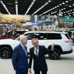 
              President Joe Biden speaks with Carlos Tavares, CEO of Stellantis, during a tour at the Detroit Auto Show, Wednesday, Sept. 14, 2022, in Detroit. (AP Photo/Evan Vucci)
            