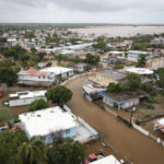
              Playa Salinas is flooded after the passing of Hurricane Fiona in Salinas, Puerto Rico, Monday, Sept. 19, 2022. (AP Photo/Alejandro Granadillo)
            