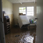 
              Mud covers the floor of a home flooded by Hurricane Fiona in Cayey, Puerto Rico, Tuesday, Sept. 20, 2022. Fiona hit Puerto Rico’s southwest corner on Sunday. (AP Photo/Stephanie Rojas)
            