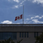 
              The Canadian flag flies at half-staff over the Canadian Embassy in Washington, Thursday, Sept. 8, 2022, after Queen Elizabeth II, Britain's longest-reigning monarch and a rock of stability across much of a turbulent century, died Thursday after 70 years on the throne. She was 96. (AP Photo/Gemunu Amarasinghe)
            